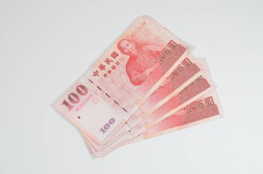 a 100 Taiwan dollar bank note. New Taiwan dollar