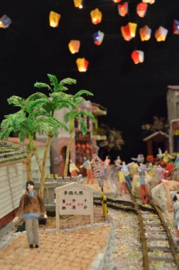 a scale model and figure , the city life