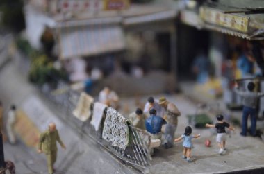 a scale model and figure , the city life