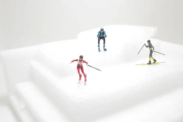 a fun of mini people skiing, sport concept