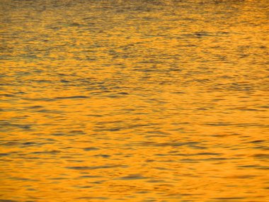 Sea at sunset, the orange color at nature