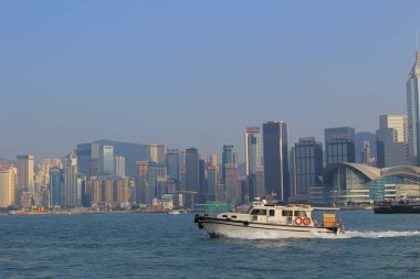 ship with skyscrapers of Hong Kong in the background. 7 Sept 2013