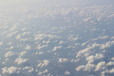 the Shot taken from a plane, flying above the clouds
