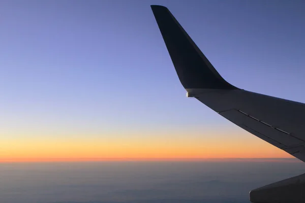 the sky from the plane, plane wing, sunset time