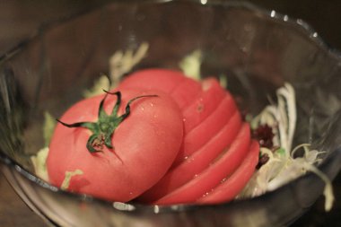 the Fresh tomatoes on a green stem
