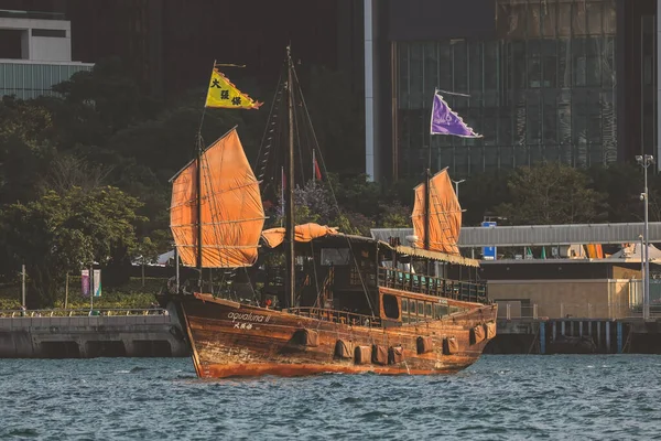 stock image March 5 2023 Hong Kong Victoria Harbour with junk boat