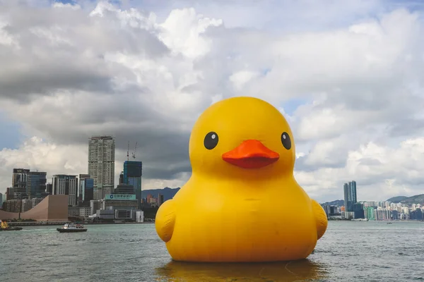 stock image giant Rubber Duck in HK, background of kowloon, June 9 2023