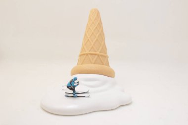 a Skier skiing downhill white icing on an ice cream cone.