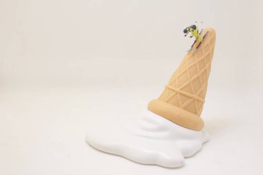 a Skier skiing downhill white icing on an ice cream cone.