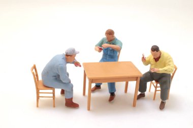 the Group of People Sitting and Standing Around a Table