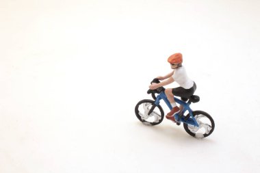 One person riding a bicycle with a helmet on.