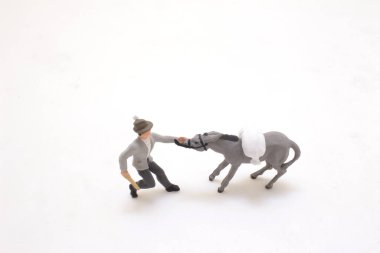 A person walking alone on a white background.