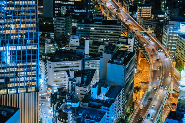 bustling urban metropolis with illuminated buildings. Nov 28 2023