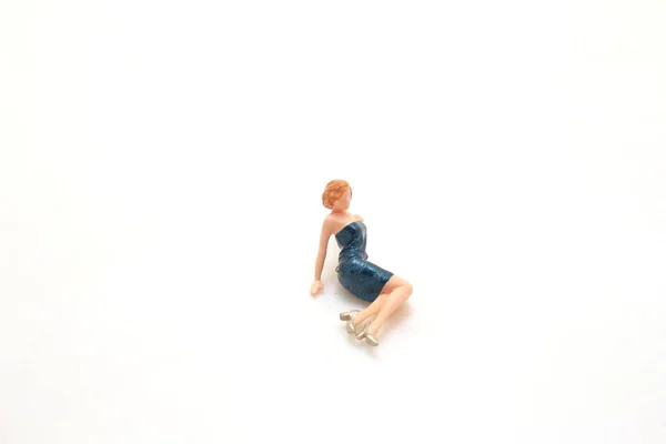 a Tiny figurine of lady in elegant attire isolated