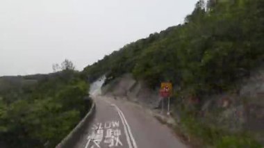 HONG KONG - 29 Mart 2024; Shek O 'nun gündüz vakti zaman aşımı yolu 