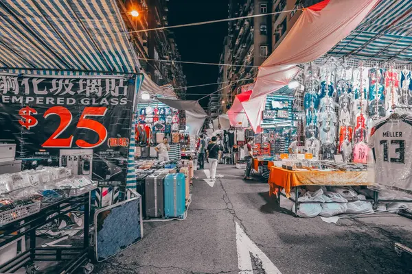 stock image June 15 2024 Mong Kok. Night Hong Kong cityscape with neon ads, street