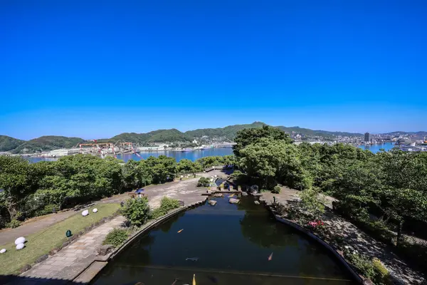 stock image the pond and garden before the Former Mitsubishi No.2 Dock House May 14 2024