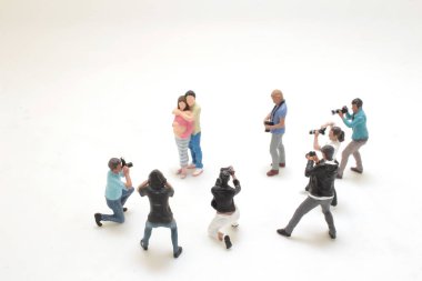 photographer in the process of shooting a model clipart