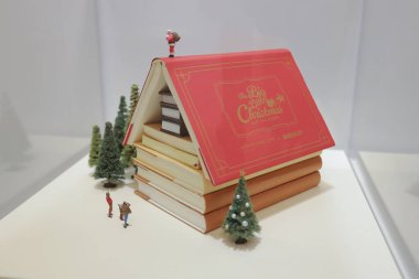 Creative Christmas Book House With Miniature Scene Nov 22 2024 clipart