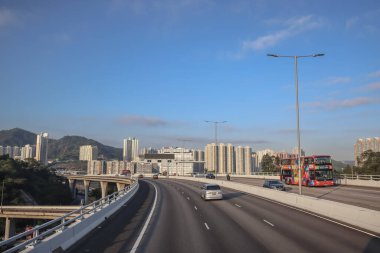 Dec 3 2024 Urban view showcasing tall residential buildings, a busy highway clipart