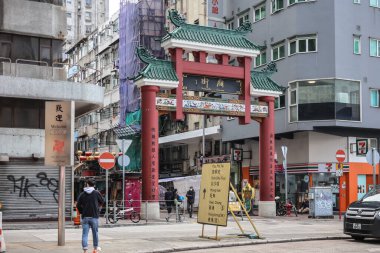 Dec 10 2024 Traditional Chinese Gate in Vibrant Urban Street Scene clipart