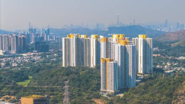 Jan 11 2025 Stunning view of urban high rise buildings set amidst lush greenery clipart