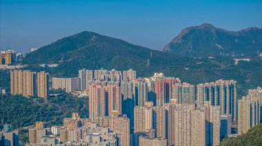 Dec 21 2024 Urban High Rise Buildings Against Scenic Mountain TKO, HK clipart