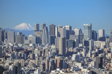 9 Aralık 2024 Tokyo 'nun hareketli şehir manzarası ve görkemli Mt. Fuji