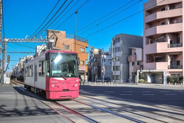 Dec 6 2024 red tram amidst a vibrant urban environment clipart