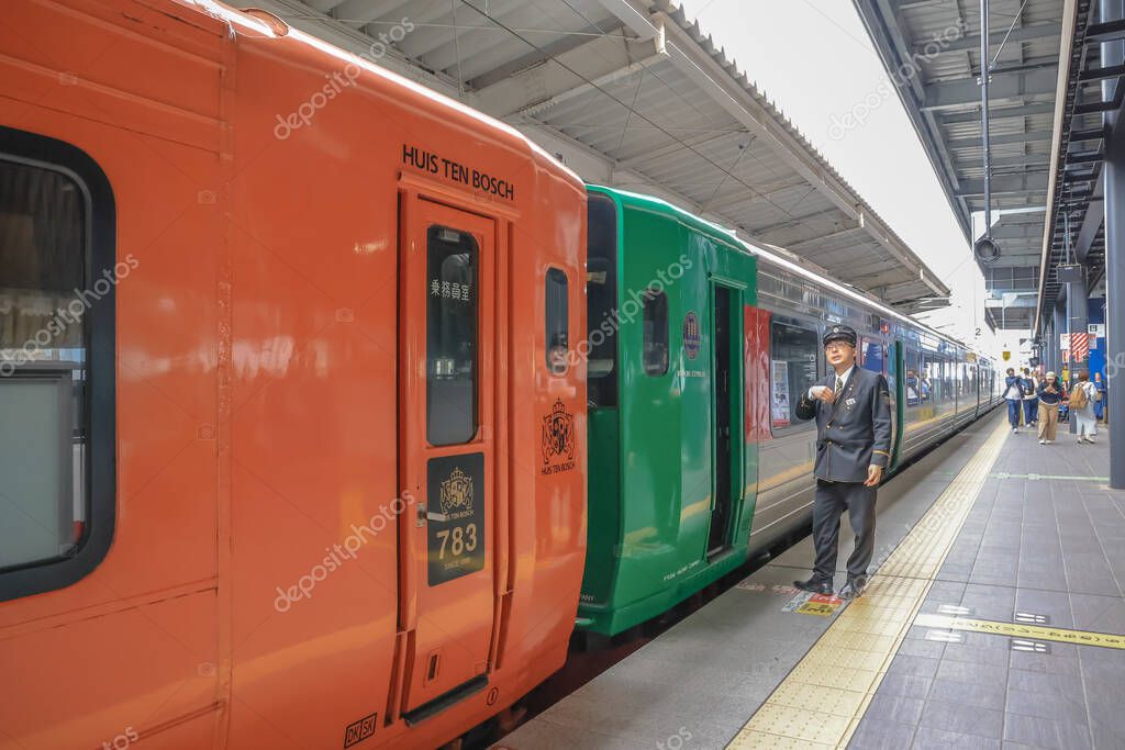 Brightly colored train cars of Huis Ten Bosch and Midori Express stationed