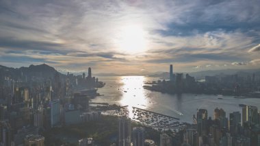 Kowloon Hong Kong 'da Günbatımı Skyline Liman Manzarası