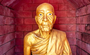 Golden statue at a famous Buddhist temple in Mae Sot Thailand