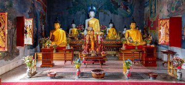 Golden statues at a Buddhist temple in Mae Sot Thailand