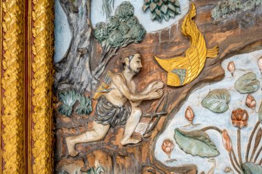 Luang Prabang Laos 'taki Wat Hosian Voravihane Budist Tapınağı' nda renkli bir fresk.