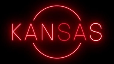 Kırmızı yanıp sönen ve yanıp sönen Kansas tabelası.