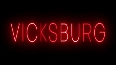 Vicksburg şehri için yanıp sönen kırmızı neon ışığı.