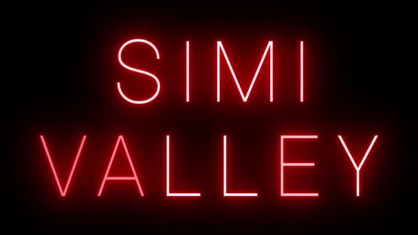 赤いレトロスタイルのネオンサインは Simi Valleyの黒い背景に輝いています — ストック動画