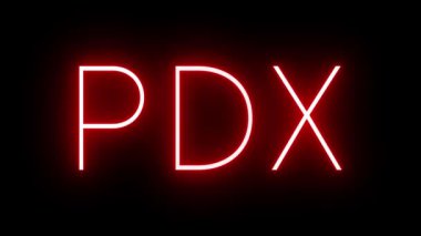 Portland Havaalanı 'nın üç harfli tanımlayıcısı ile yanıp sönen kırmızı retro-neon işareti.
