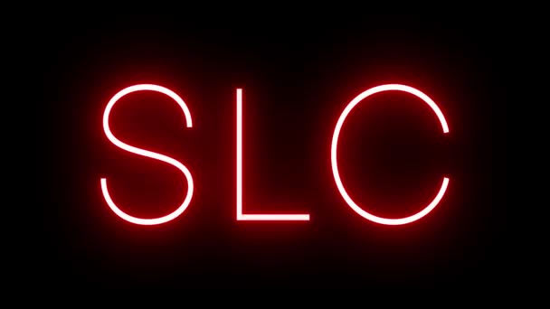 ソルトレイクシティ空港の3文字の識別子と赤いレトロネオンサインの輝きと点滅 — ストック動画