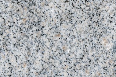 Kuzey Hindistan 'dan alınan siyah, gri ve pembe benekli Himalaya granitinin yakın çekimi.