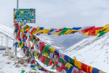 Summit of the Khardung La pass in the Himalayas, at 17,582 feet one of the world's highest elevation roads clipart