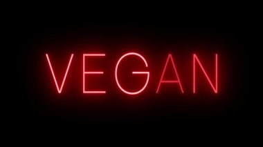 VEGAN için siyah bir arkaplan üzerinde parlayan yanıp sönen kırmızı retro tarzı neon tabela
