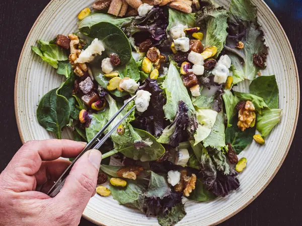 healthy food salad with vegetables, figs, lettuce, walnuts, parmesan