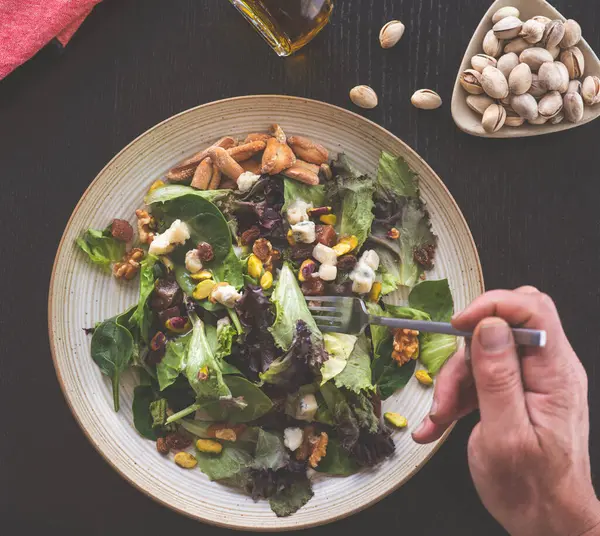 salad bowl with vegetables and herbs, close up