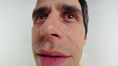 A distorted, funny portrait of a man with a fisheye lens effect.