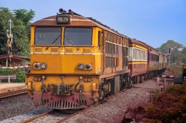 Passenger train by diesel locomotive on the railway.