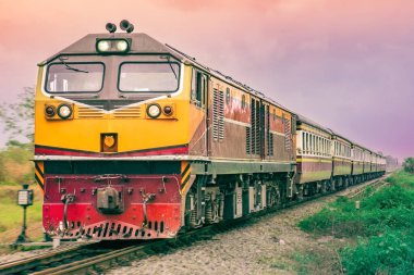 Tanker-freight train by diesel locomotive on the railway.