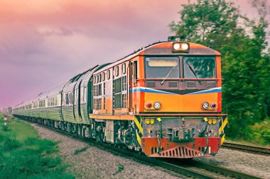 Tanker-freight train by diesel locomotive on the railway.