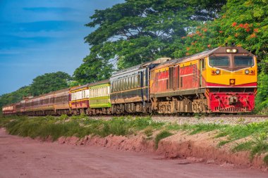 Passenger train by diesel locomotive on the railway.