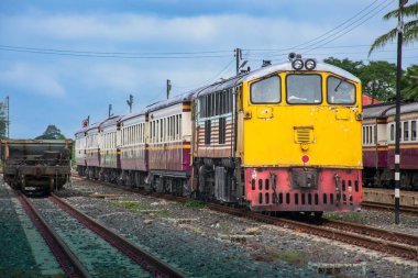 Passenger train by diesel locomotive on the railway.